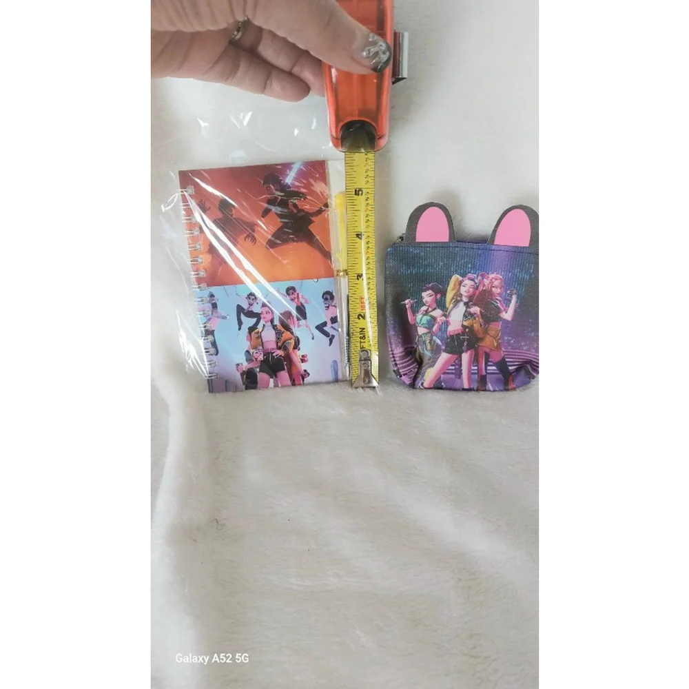 Be on the KPOP scene with Rumi, Mira, & Zoey. With this Notebook and Coin purse